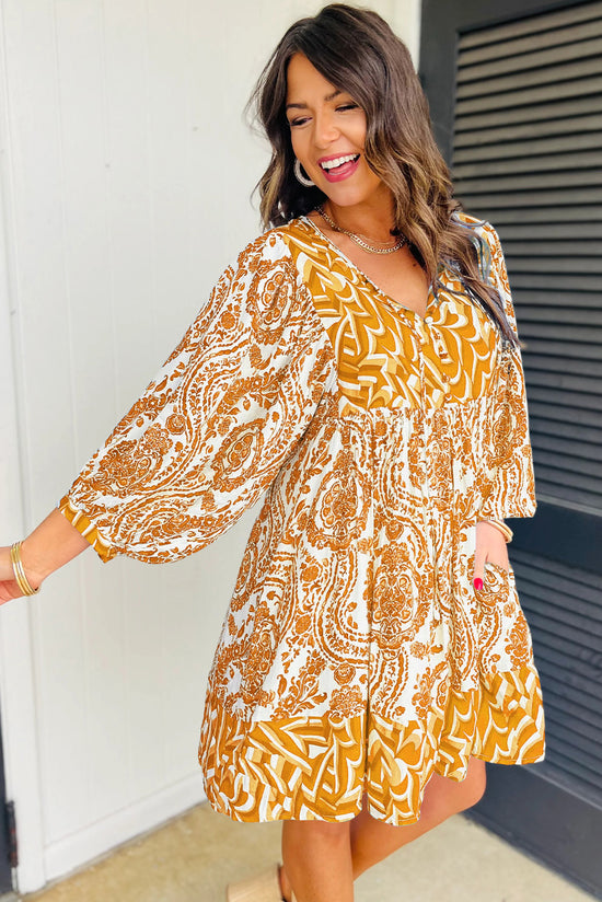 Orange bohemian print flared mini dress with puff sleeves and knotted V-neck