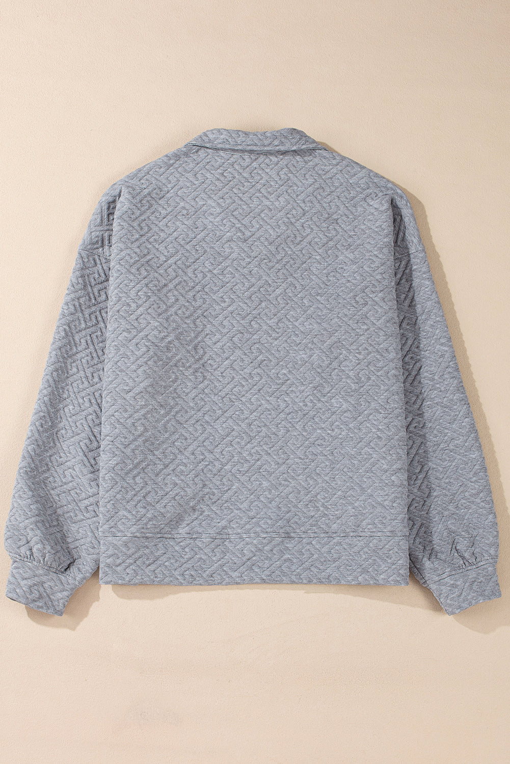 Sudadera gris con media fera éclair textúe uni