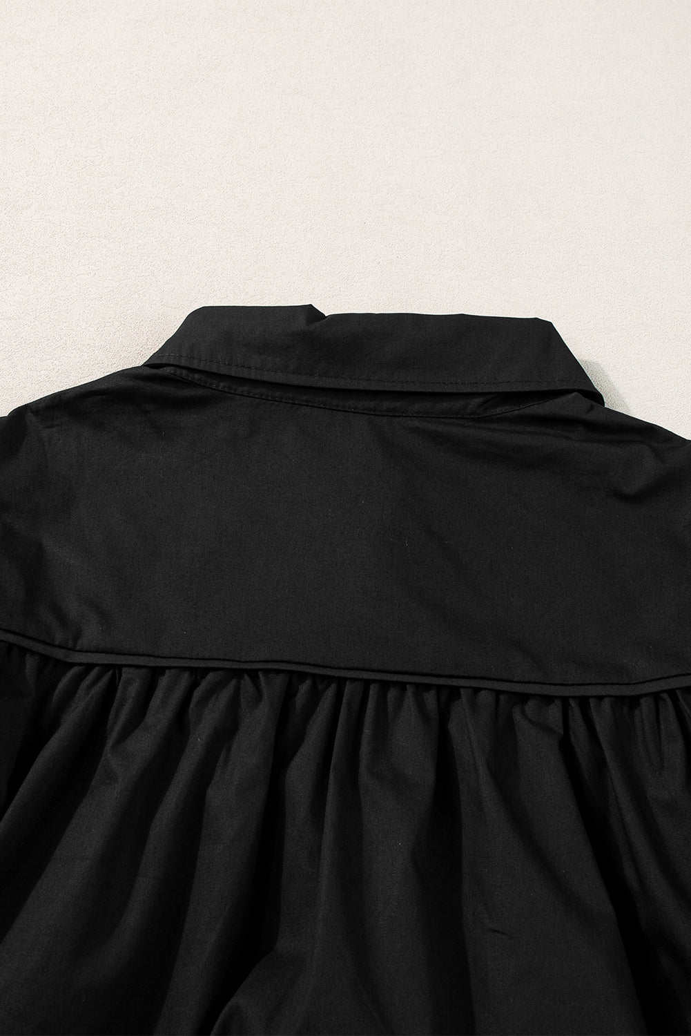 Chemise ample noire à manches bouffantes-A WOMAN WE LOVE