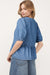 Twilight blue denim shirt tied on the front with bubble and basque sleeves