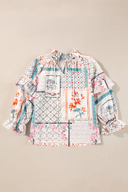 Multicolored blouse with knotted collar and cracked sleeves with bohemian style floral patches