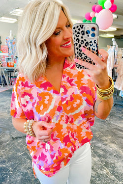 Summer blouse in v -collar in v abstract pink red print