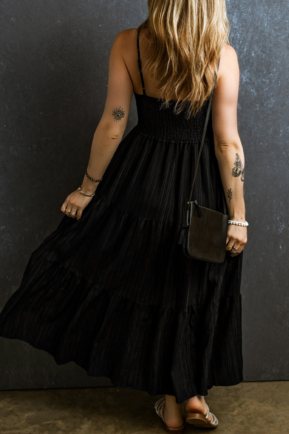 Black long dress with ruffles and spaghetti straps, smocked and pleated