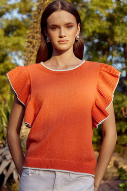 Knitted top with ruffled sleeves and contrasting trim in russet orange