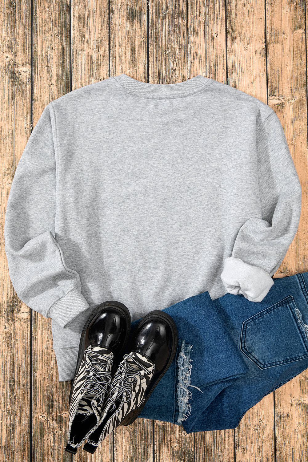 Sudadera gris en tela de esponja con hombro caído forrado con vellón liso