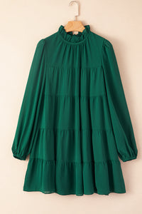 Robe verte à volants et manches bouffantes *