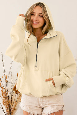 Beige zip-up hoodie with kangaroo pocket and ribbed trim