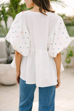 White blouse embroidered with puffy sleeves and v -collar