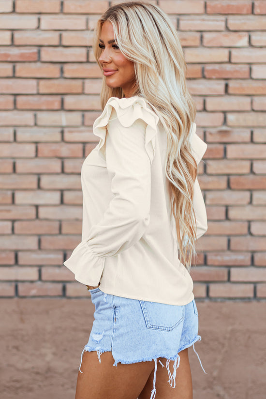 Blusa de terciopelo acanalado beige con volantes y mangas de volantes