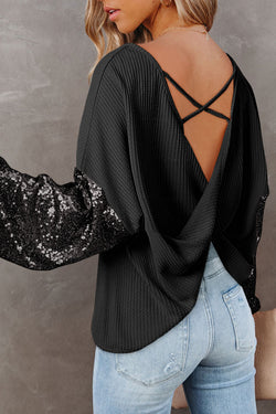 Black waffle knit top with patchwork sleeves and open back