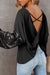 Black waffle knit top with patchwork sleeves and open back