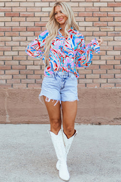 Pink blouse with abstract print and ruffled collar and ruffle sleeves