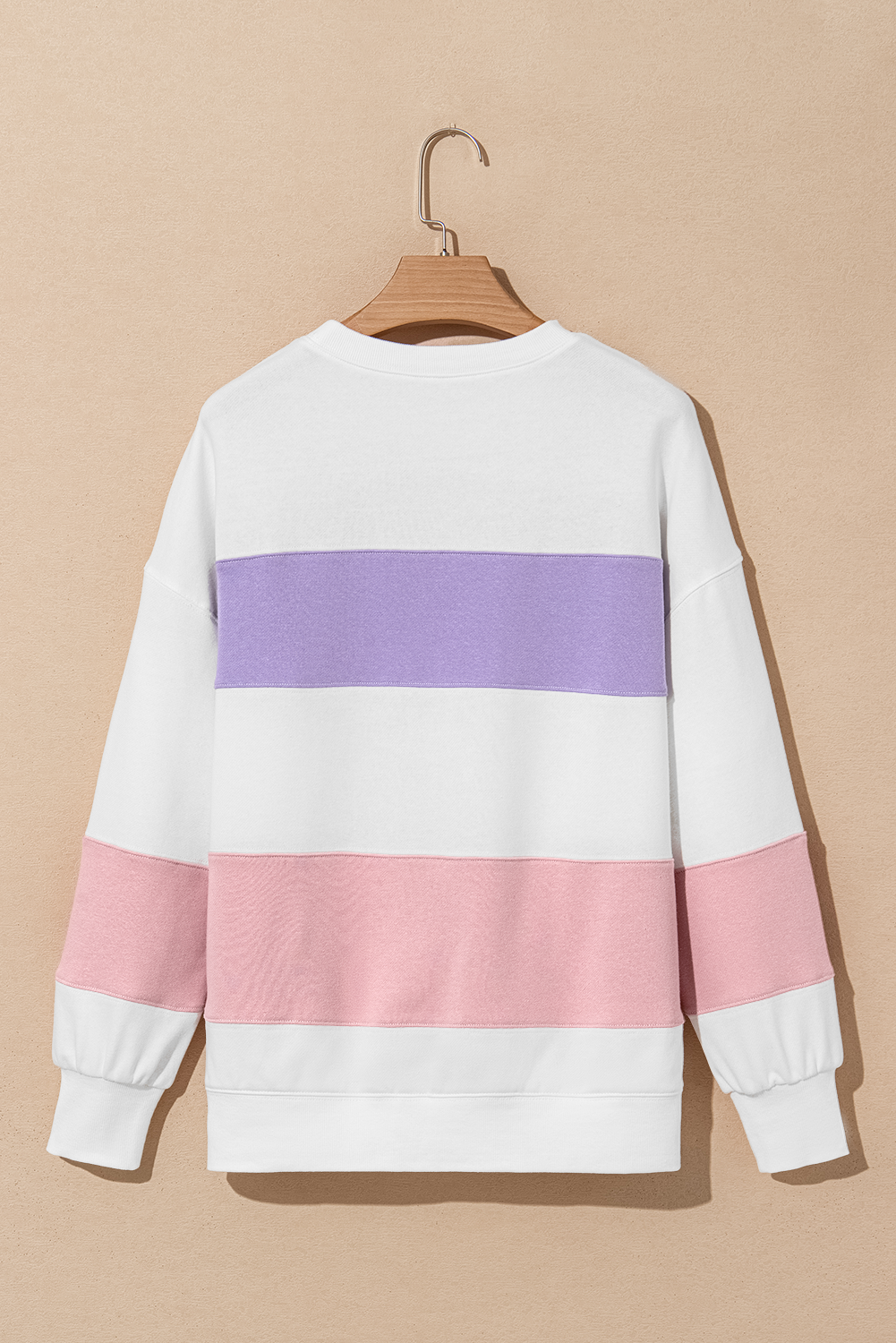 Sudadera beige con cuello redondo y hombros que caen en bloque de color de retazos