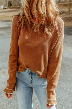 High textured brown with long sleeves and round neck *