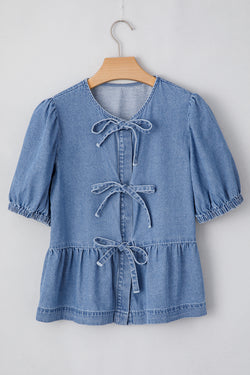 Twilight blue denim shirt tied on the front with bubble and basque sleeves