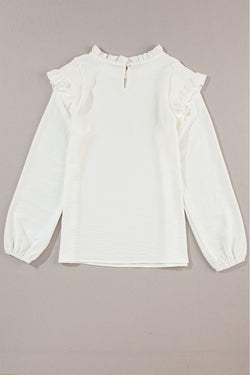 White blouse with puffy sleeves and ruffle border and ruffle collar