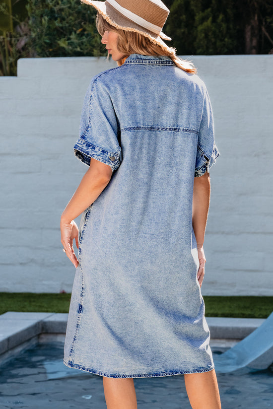 Light blue chambray shirt dress with short sleeves and medium washing