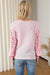 Waffle knit top with exposed seams and pink leopard patchwork