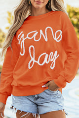 Sudadera gráfica de hombro caída y day de juegos de ruso naranja guirnaldas