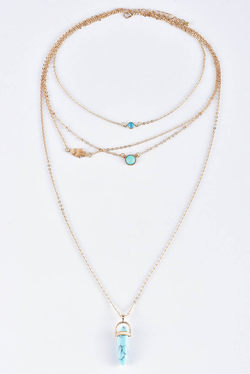 Collier multicouche avec pendentif en pierre précieuse turquoise dorée