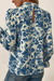 Sky blue blouse with floral print and ruffle sleeves *