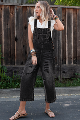 Salopette en jean noir effet vieilli avec poche à bavette et jambe large