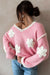 Sweater rosa de hombro rosado y cuello en forma de V en forma de V