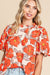 Orange loose sleeve blouse and flying collar and floral pattern