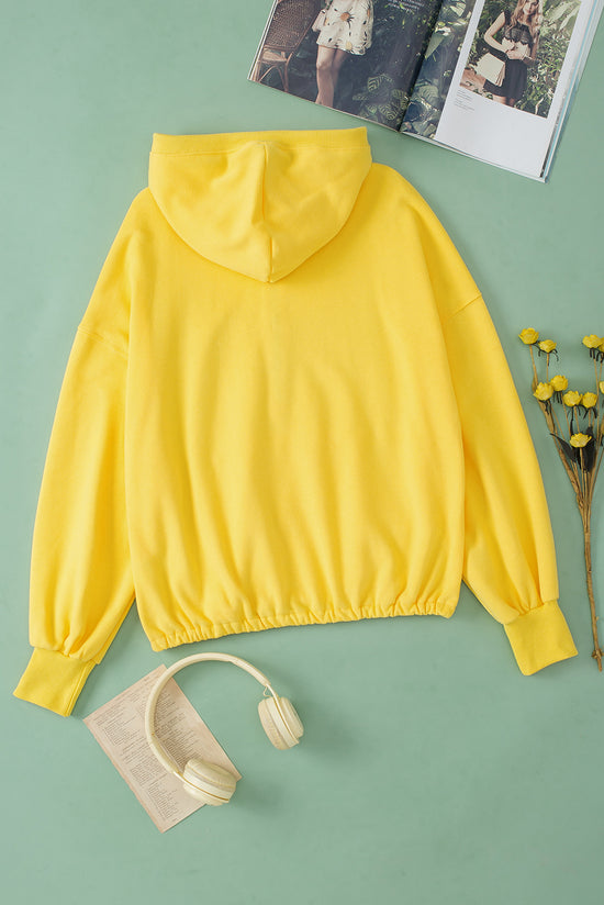 Yellow zip-up hoodie with kangaroo pocket and ribbed trim