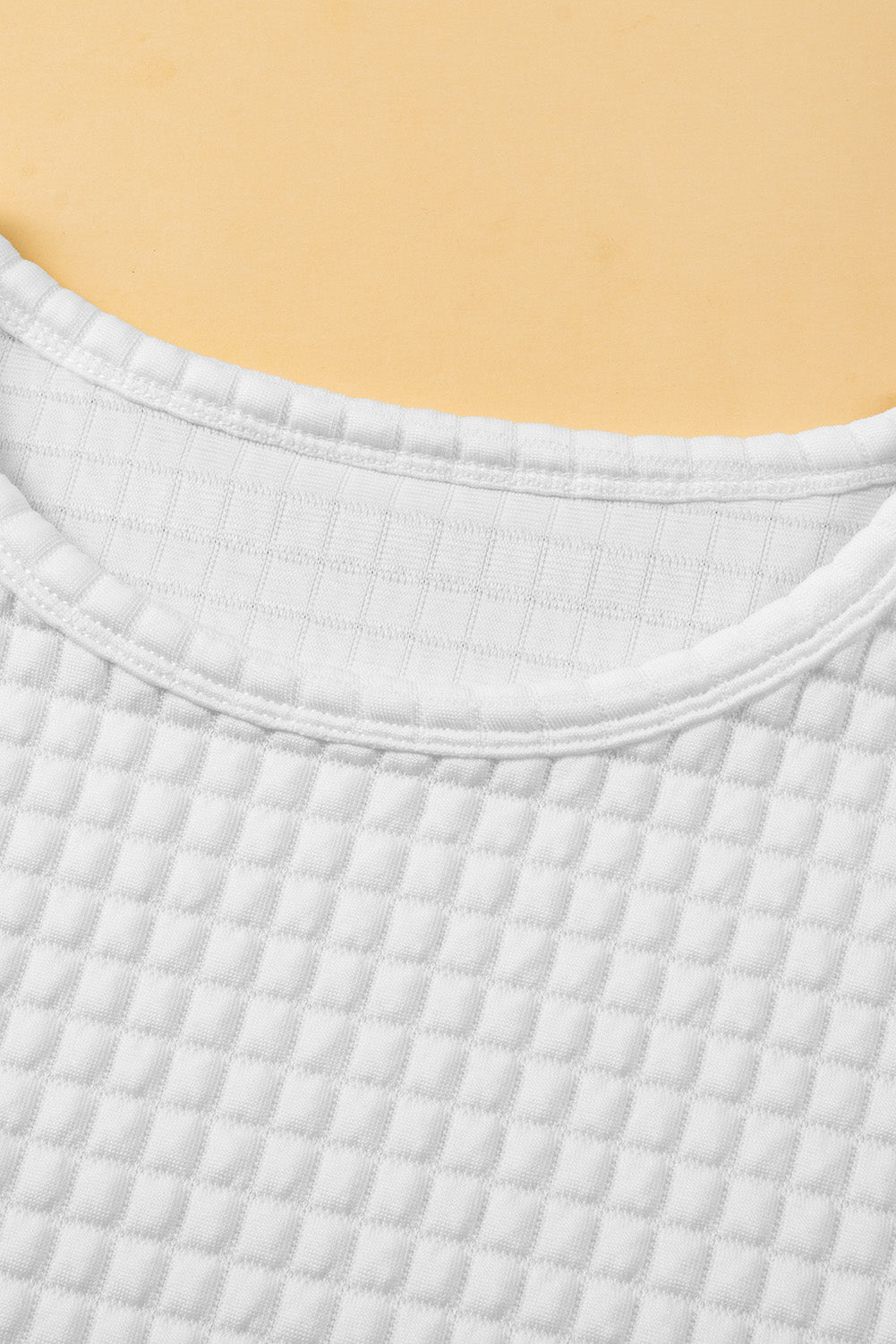 White T-shirt with textured checkered bat handles
