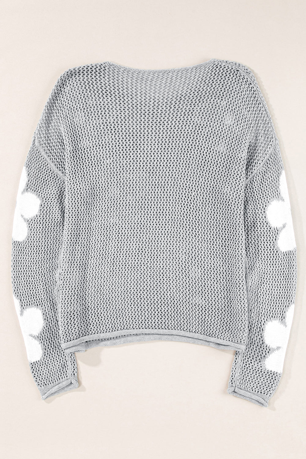 Light gray sweater with drooping shoulders in openwork knitting with large flowers