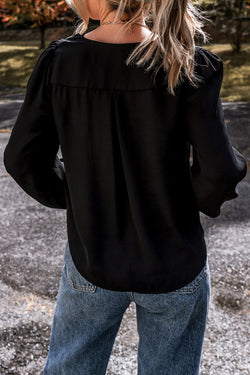 Black V -neck blouse and crochet lace cuffs