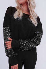 Blouse noire à manches lanternes et patchwork de sequins-A WOMAN WE LOVE