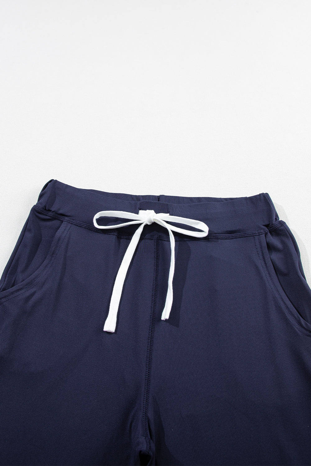 Navy blue jogging pants with pockets and drawstring waist