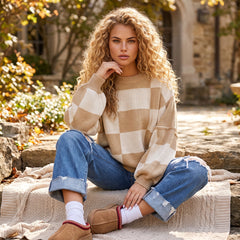 Pull beige à carreaux et manches bouffantes