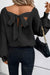 Black sweater with lantern sleeves, V-neck, knot at the back