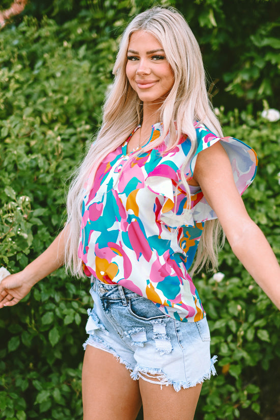 Multicolored blouse with abstract print and notched collar with floating sleeves