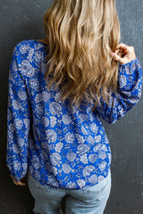 Chemisier bleu à manches longues et col en V cranté à fleurs-A WOMAN WE LOVE
