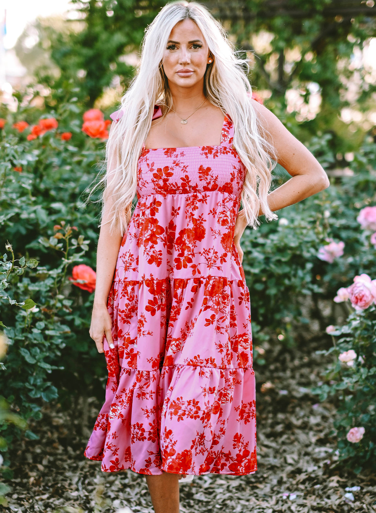 Pink floral dress with ruffles and tied straps