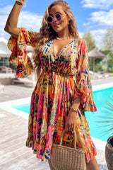 Robe fluide rose à manches évasées *