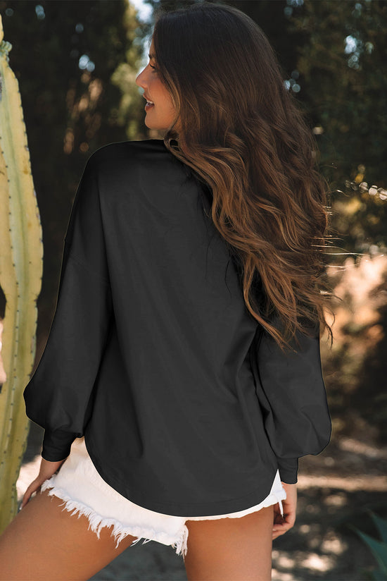 Black oversized high with long sleeves and studded star pattern