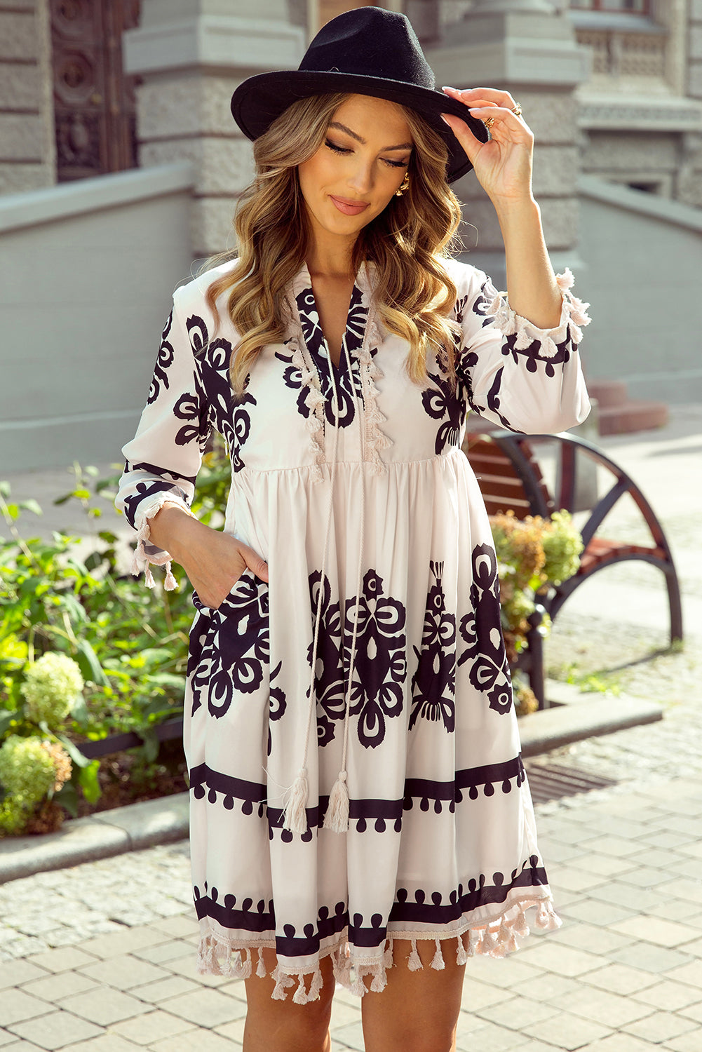 Beige V-neck mini dress with western pattern print tassels