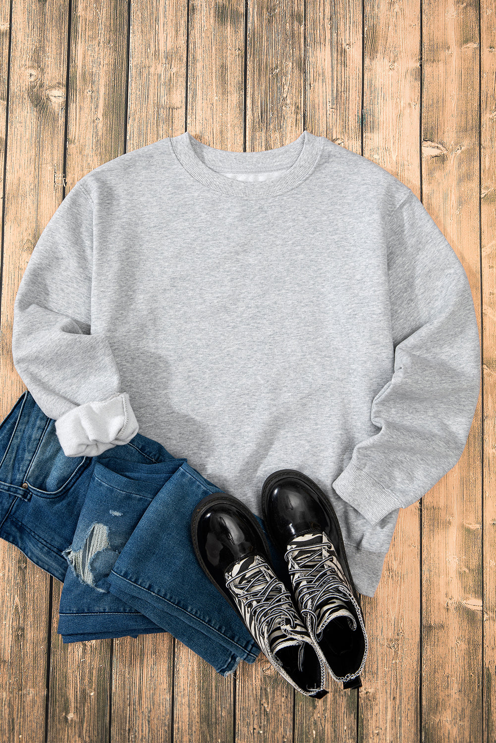 Sudadera gris en tela de esponja con hombro caído forrado con vellón liso