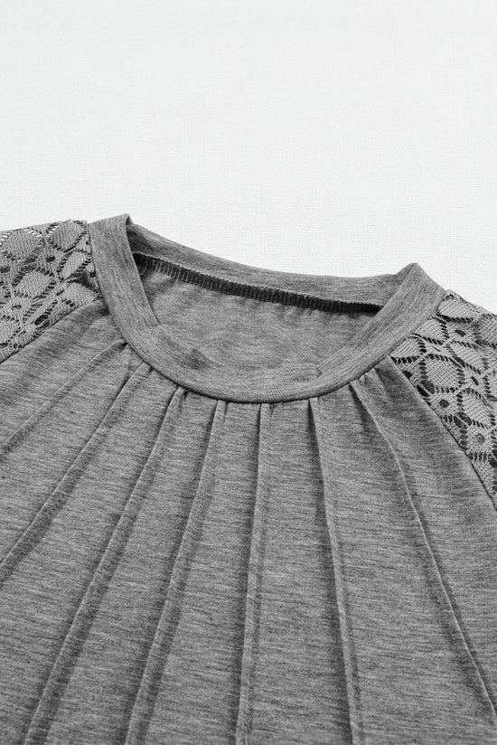 Grey pleated knit top with raglan sleeves and contrast lace