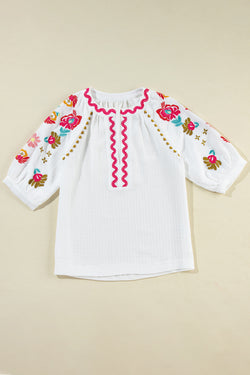 White textured blouse with puffy sleeves and Ricrac floral embroidery