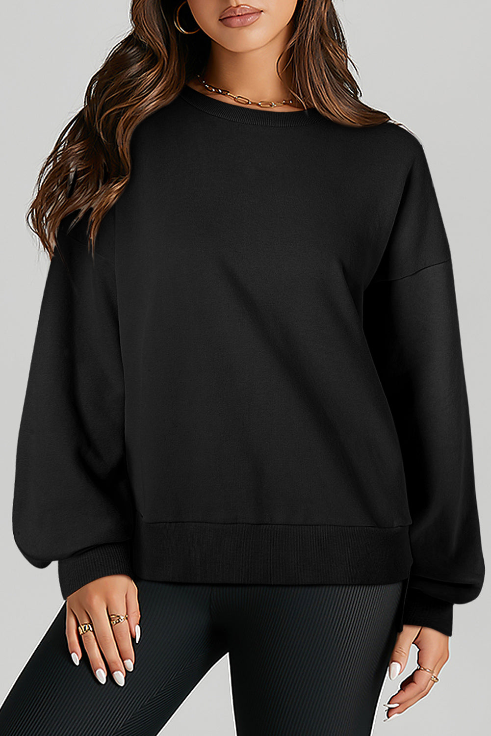 Sweat-shirt noir uni à col rond et ourlet haut et bas