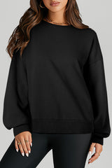 Sweat-shirt noir uni à col rond et ourlet haut et bas