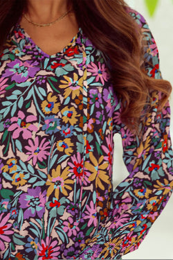 Multicolored V -collar blouse and long sleeves with ruffles and floral print