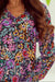 Multicolored V -collar blouse and long sleeves with ruffles and floral print