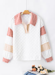 Loose-fitting white plaid top with exposed seams, V-neck